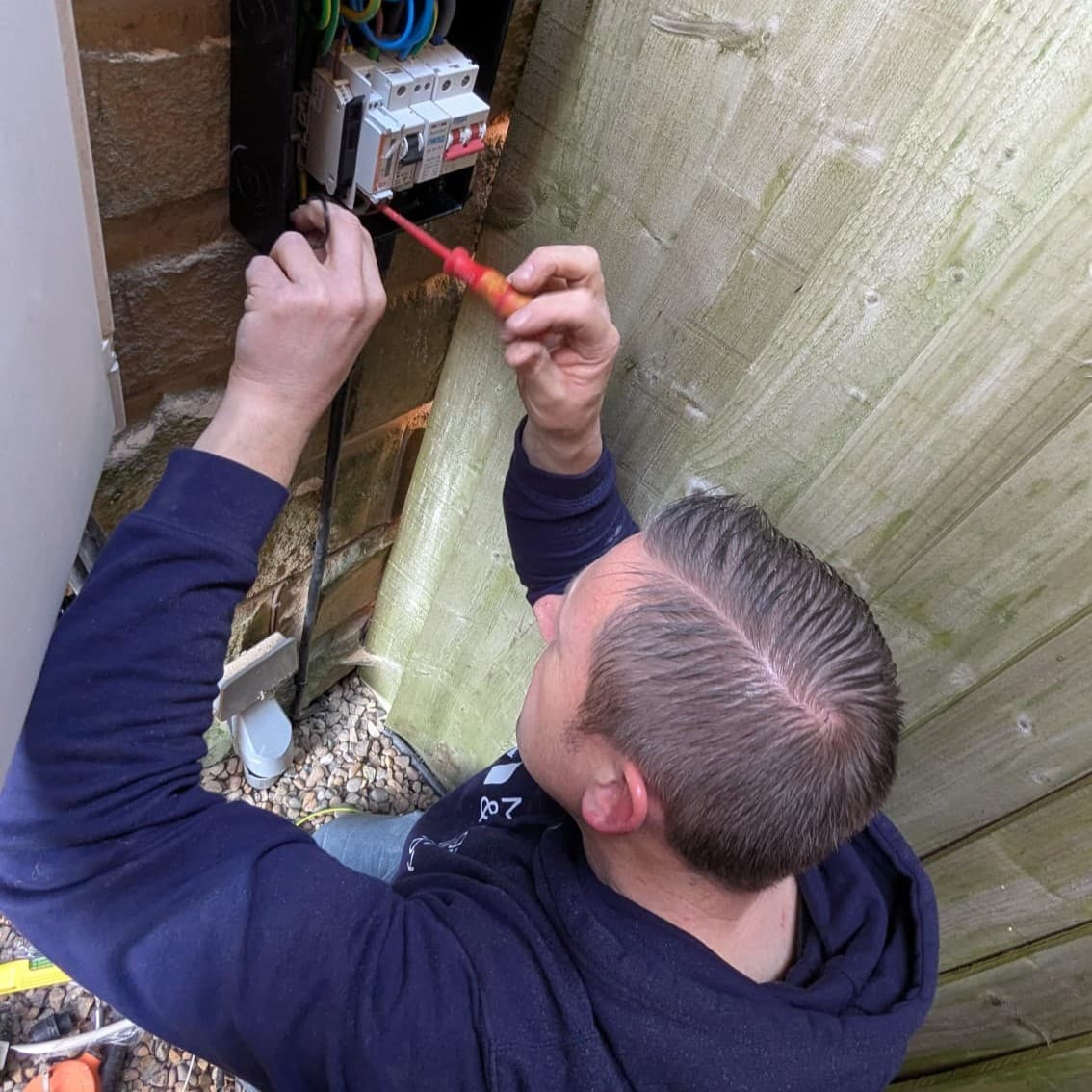 Vimma installer wiring an outdoor connection
