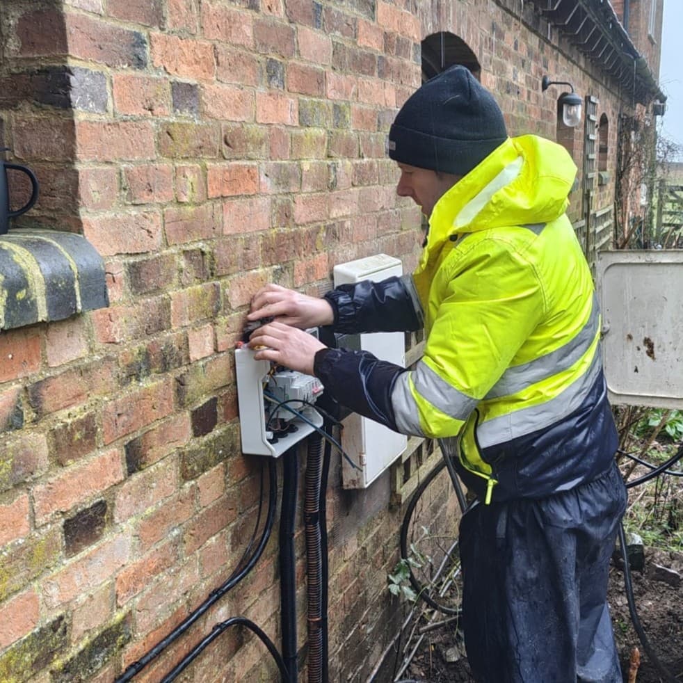 Vimma installer fitting an outdoor isolator